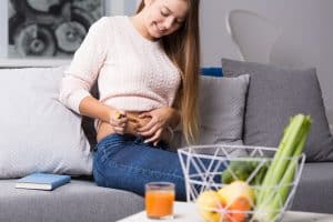 a woman injects herself. Ozempic for weight loss has become a popular use of the glp-1 drug.